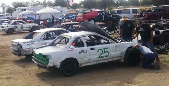 Randy Brown Jr. and his crew work on their car before the races at Hanford Saturday night at the Kings County Fair.